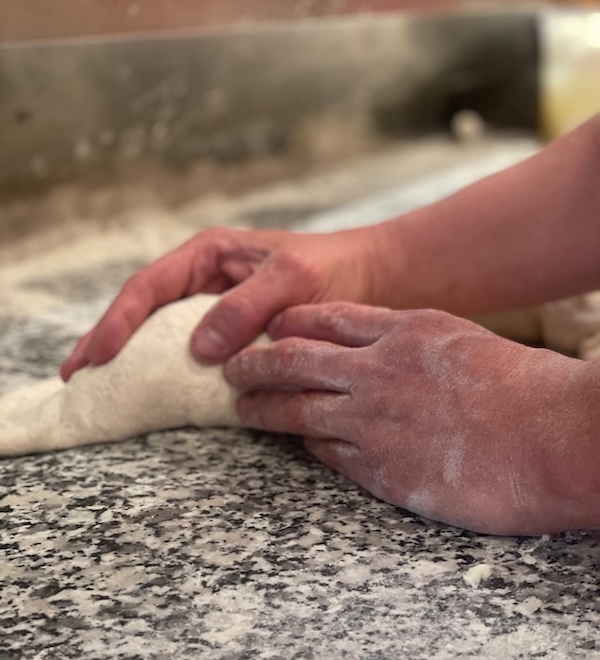 Fresh pizza dough preparation